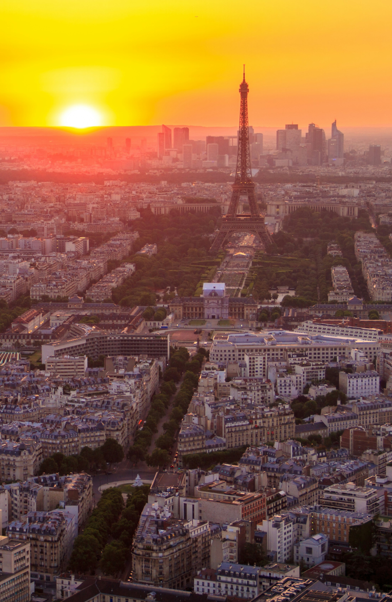 Aerial view of the Eiffel Tower and Paris at sunset