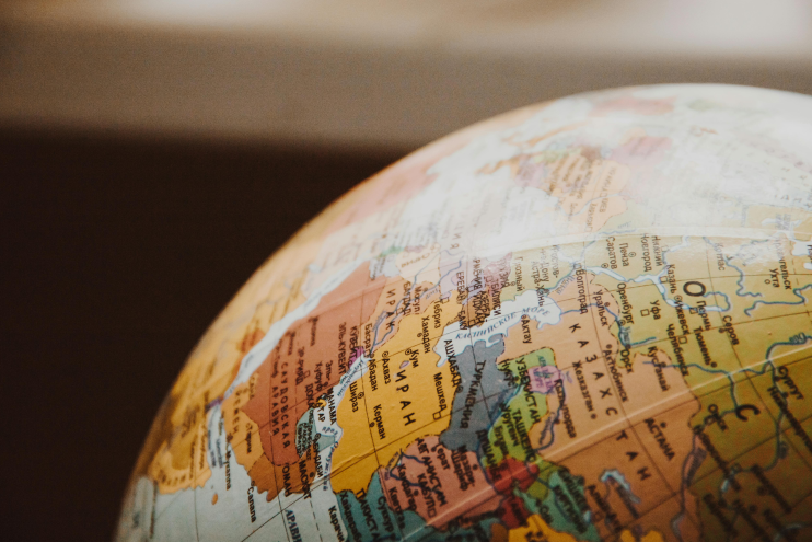 Close-up of a globe showing the Middle East and Central Asia, ideal for travel planning themes.