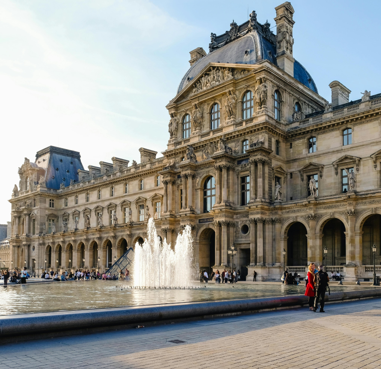 Louvre Museum courtyard with fountain in Paris, France