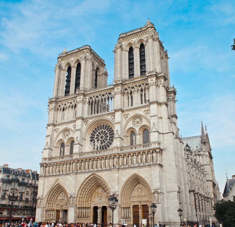 Front façade of Notre-Dame Cathedral in Paris with twin towers and a rose window