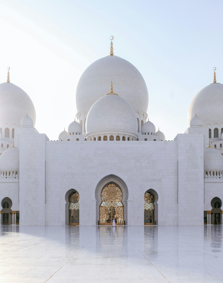 Sheikh Zayed Grand Mosque in Abu Dhabi with white marble domes and intricate Islamic architecture