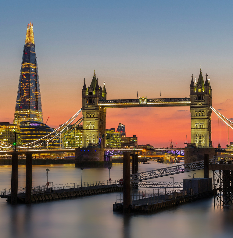 Hotels Near London Heathrow Airport (LHR). Sunset view of Tower Bridge and The Shard in London, seen from the River Thames – iconic landmarks near Central London hotels.