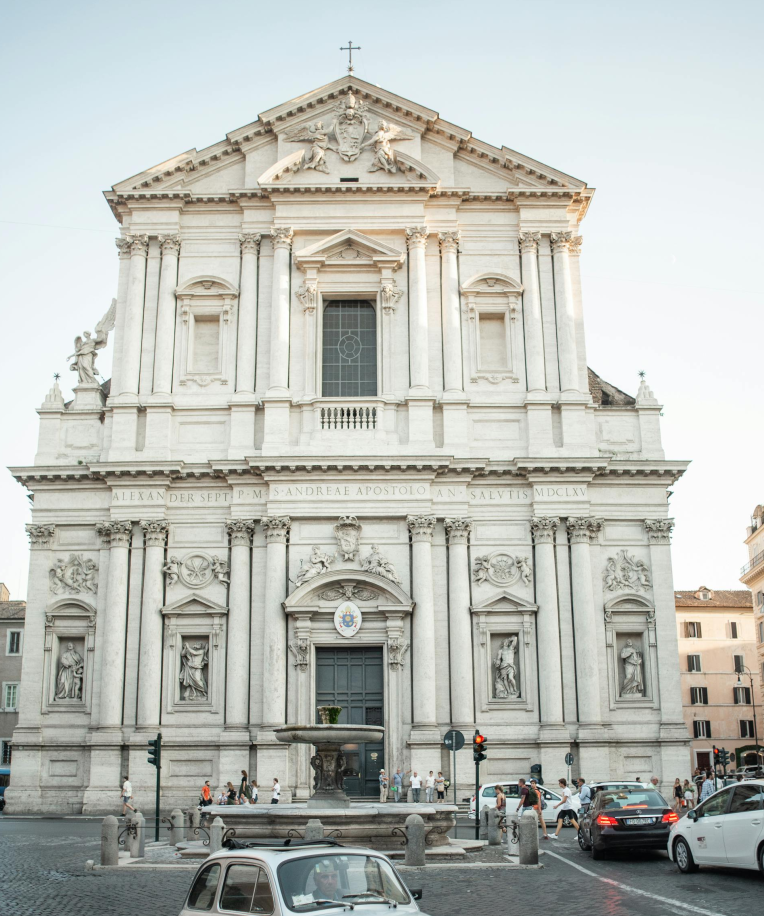 Facade of Sant’Andrea della Valle church in Rome, Italy, with baroque architecture, statues and fountain in front near Piazza Navona.